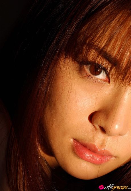 Asian beauty Maria Takagi poses in her sexy fishnet stockings