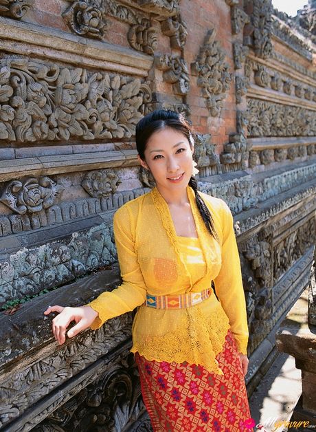 Angelic Asian babe Hiroko Sato presents her big melons and her shaved pussy