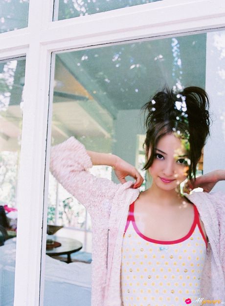 Asian teen Nozomi Sasaki shows her teeny tits and poses in a solo