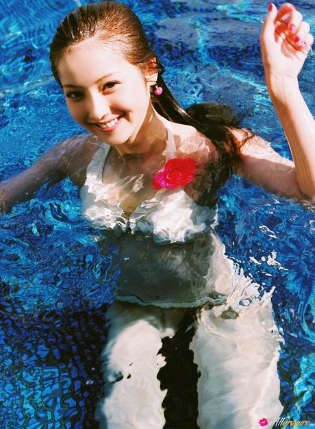 Asian teen Nozomi Sasaki shows her teeny tits and poses in a solo