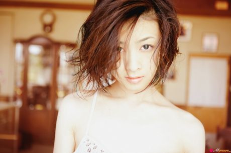 Asian teen Miho Sugiura shows her small tits and poses in a solo