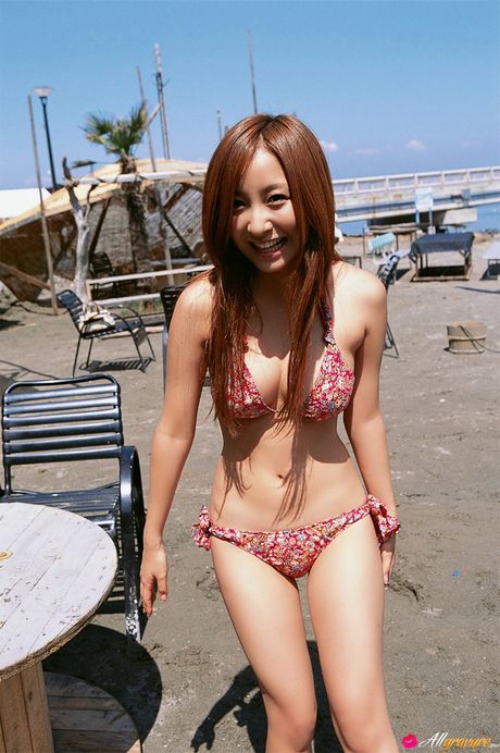 Beautiful Asian babe Aya Kiguchi highlights her big racks and her shaved pussy