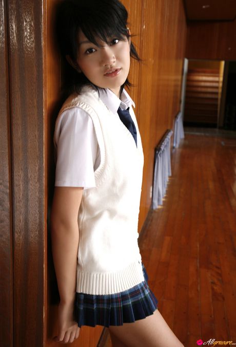 Asian girl Asami Tada removes her bikini and displays her bare skin in the bathroom