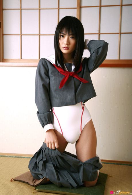 Asian stunner Mayu Mitsu gets naked on a sofa in white knee socks