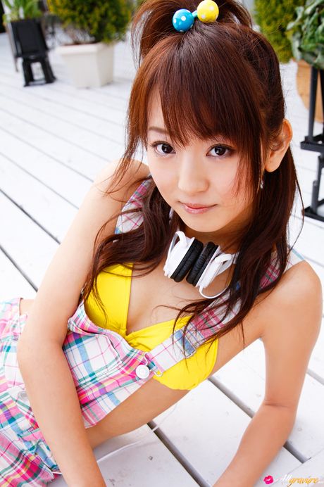 Asian babe Yukari Sato demonstrates her petite tiny tits and poses in purple stockings