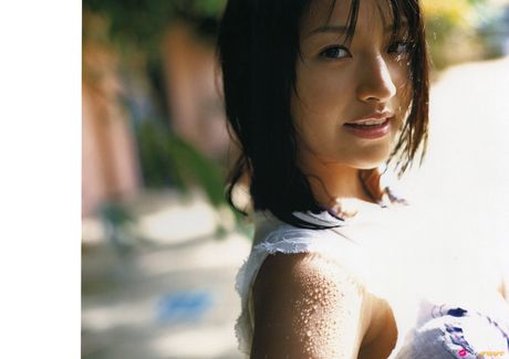 Asian girl Nina Minami exhibits her big tits and poses in a bikini