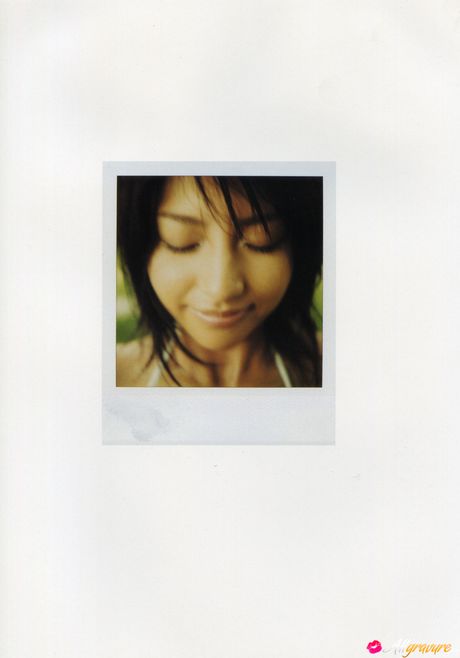 Asian girl Nina Minami exhibits her big tits and poses in a bikini