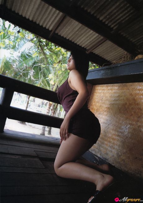 Asian girl Nina Minami exhibits her big tits and poses in a bikini