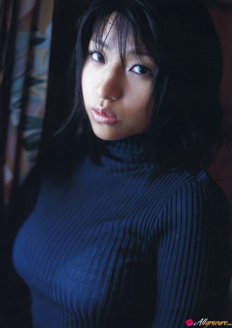 Asian girl Nina Minami exhibits her big tits and poses in a bikini