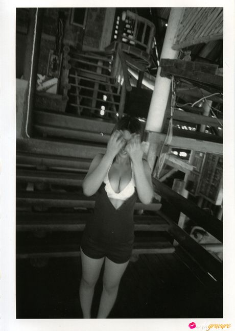 Asian girl Nina Minami exhibits her big tits and poses in a bikini