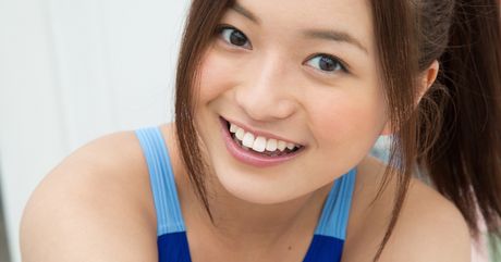 Asian covergirl Mayumi Yamanaka highlights her nice ass and poses in a swimsuit