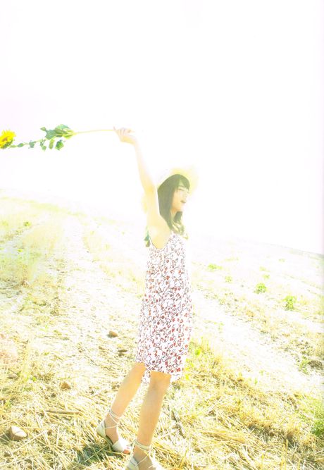 Asian girl Yumi Wakatsuki demonstrates her big tits and poses in the countryside