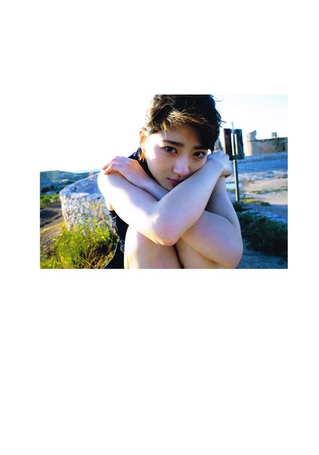 Asian girl Yumi Wakatsuki demonstrates her big tits and poses in the countryside