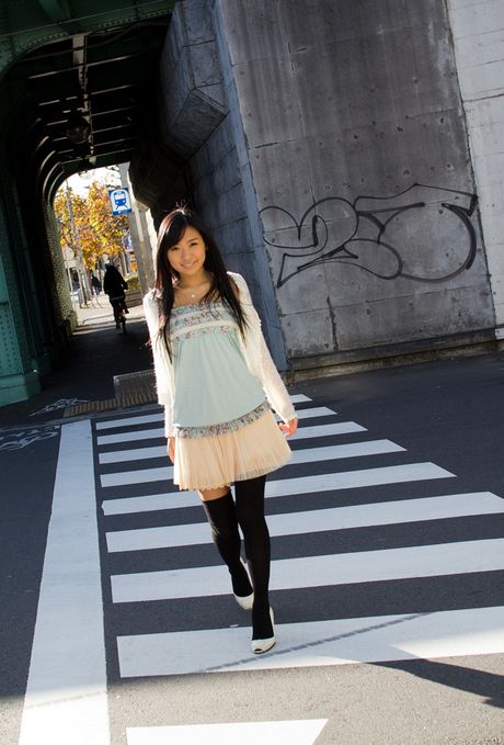 Asian doll Nana Ogura removes her dress and poses in stockings