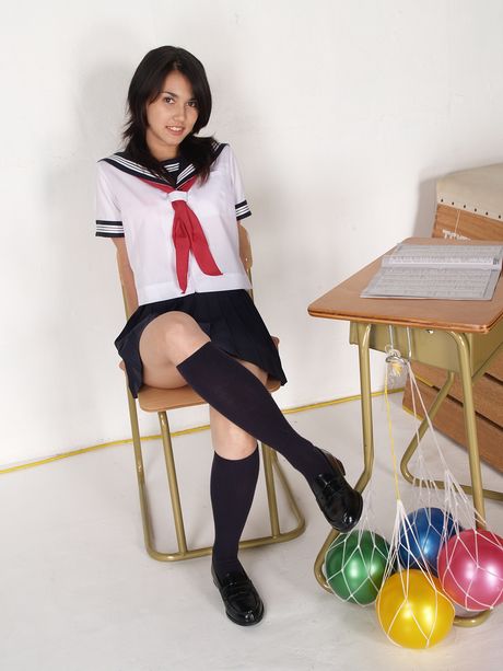 Asian schoolgirl Maria Ozawa strips to her stockings and displays her large boobs