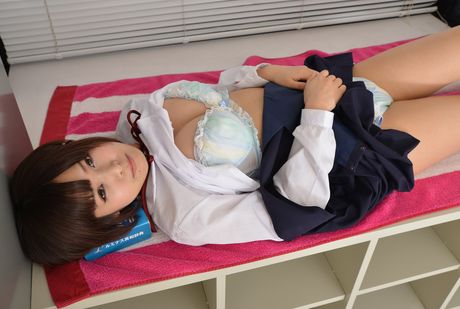 Brown-eyed cutie Mayu Satou strips to her stockings and poses