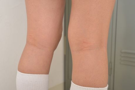 Brown-eyed cutie Mayu Satou strips to her stockings and poses