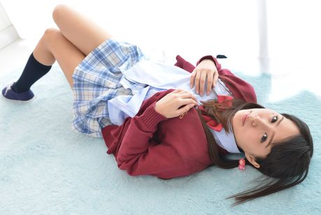 Brown-eyed Japanese babe Miho Tono exhibits her small tits and pussy