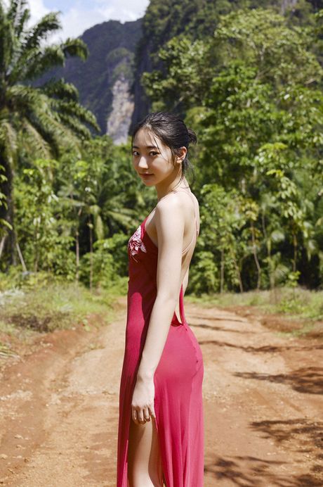 Asian doll Rena Takeda displays her nice tits and poses in a bikini