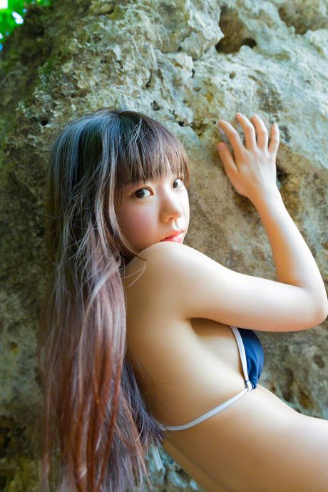 Asian teen Marina Nagasawa displays her firm tits and poses in a bikini