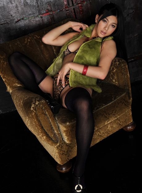 The Japanese beauty demonstrates her natural tits and her bald pussy