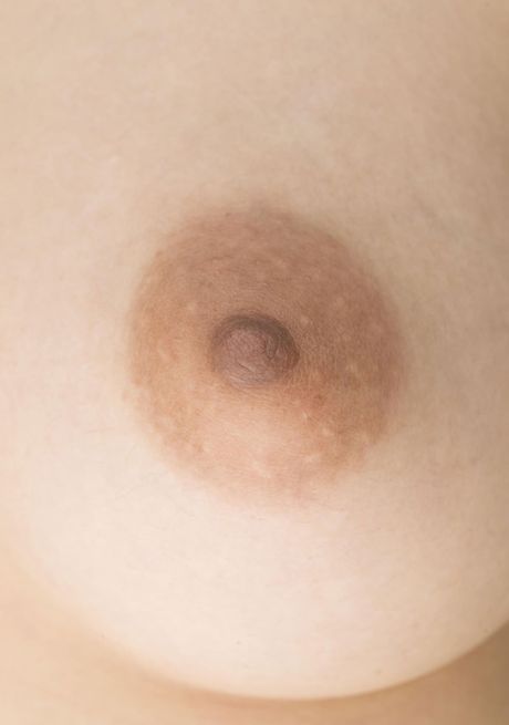 Asian girl Sakura Mana highlights her huge tits and disrobes for the modeling session in the shower