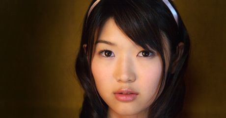 Asian beauty Noriko Kijima highlights her big racks and poses in fishnet stockings