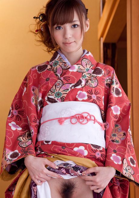 Asian girl Hoshi Ai slips off a red kimono to get naked in socks