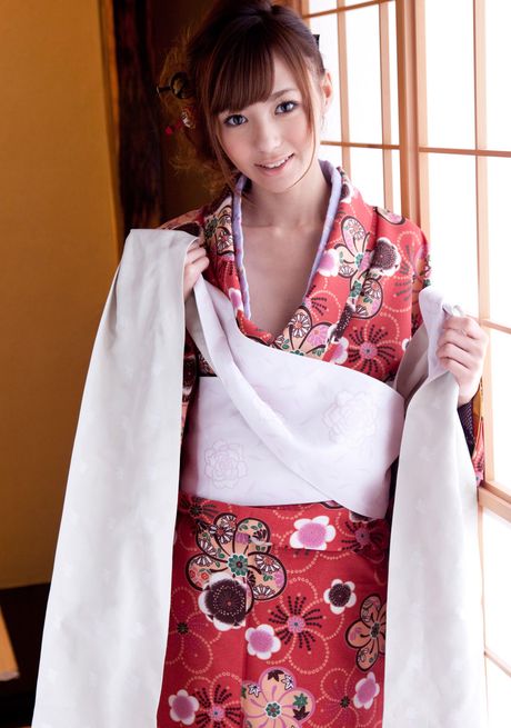 Asian girl Hoshi Ai slips off a red kimono to get naked in socks