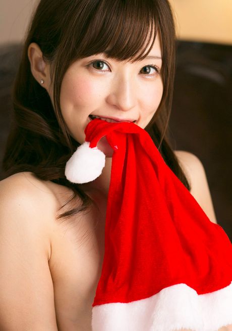 Asian covergirl Angel Moe gets naked in a Santa hat and a belt