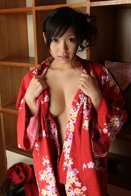 Asian covergirl Nana Ogura gets undressed on a table without shyness