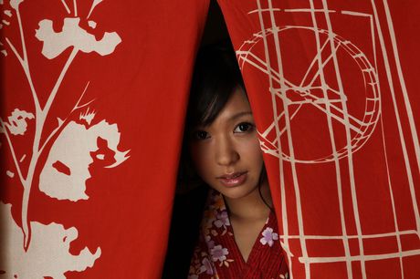 Asian covergirl Nana Ogura gets undressed on a table without shyness