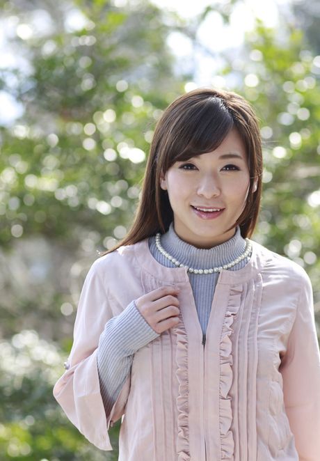 Asian covergirl Kaho Kasumi strips down on a bed enticingly