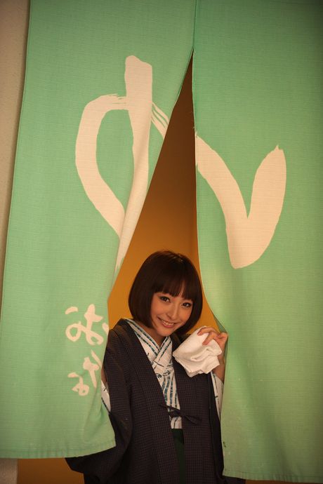 Asian doll Kotono gets completely naked on a chair with grace