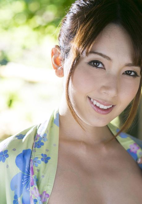 Devastating Asian babe Yui Hatano flaunts her big boobs and disrobes for the modeling session outdoors