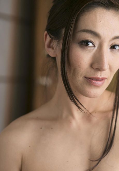 Asian model Marina Matsumoto removes a kimono to get naked in a bedroom