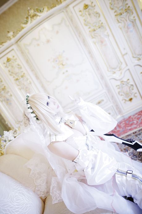 Blond japanese girl Rose D puts on a white wedding dress and gloves