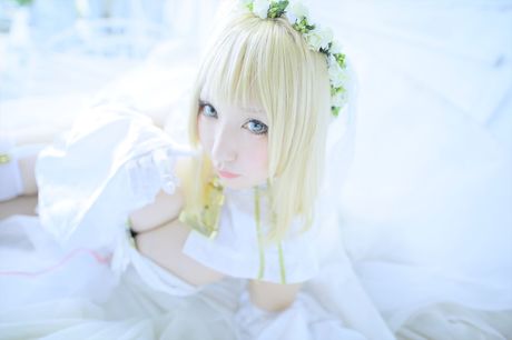 Asian girl Saku demonstrates her huge tits and poses in a white dress