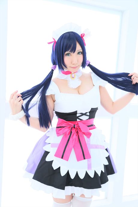 Asian girl Saku highlights her massive tits and poses in a maid uniform