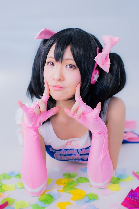 Asian cheerleader Nico Yazawa displays her huge tits and poses in stockings