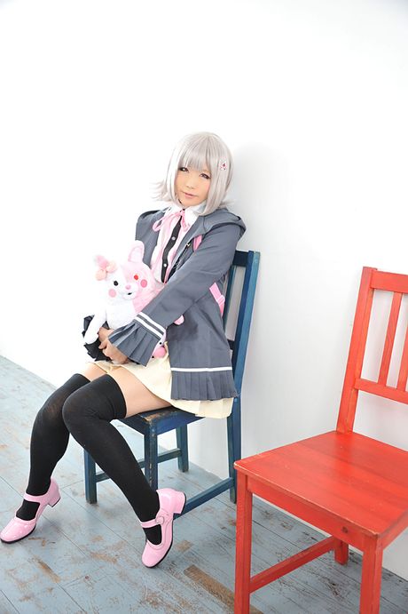 Asian doll Haruka reveals her petite small tits and poses in black stockings