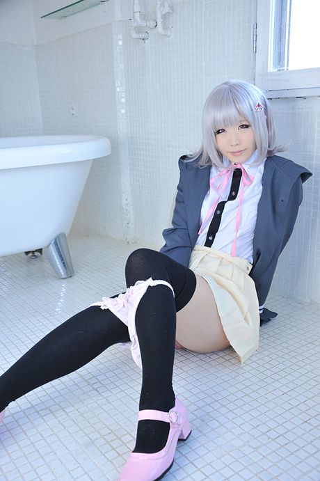 Asian doll Haruka reveals her petite small tits and poses in black stockings