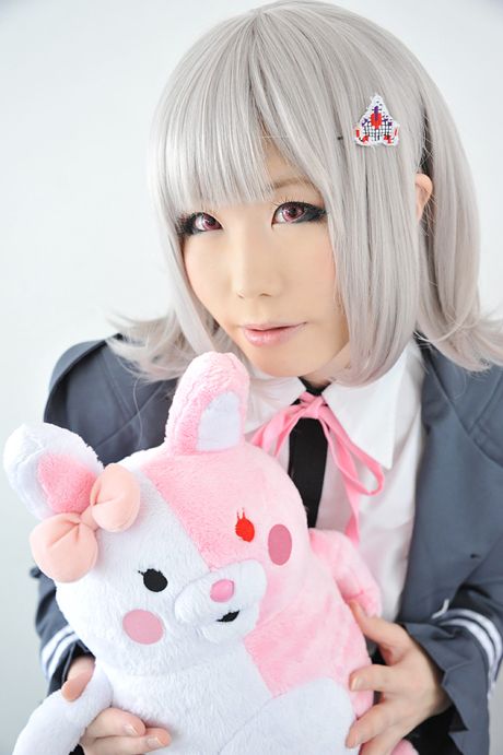 Asian doll Haruka reveals her petite small tits and poses in black stockings