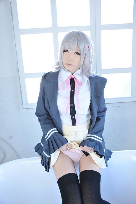 Asian doll Haruka reveals her petite small tits and poses in black stockings