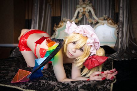 Blond japanese girl Rat Sakura sports a hat and wings while modelling in a kitchen