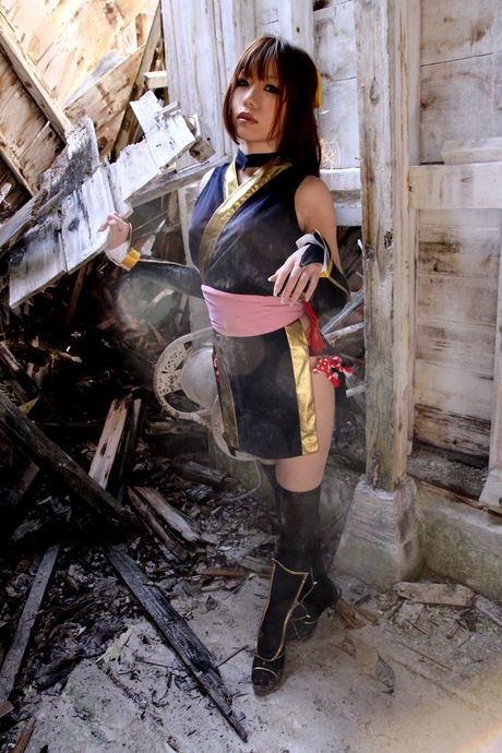 Asian stunner Higurashi Rin models a black dress and stockings in a solo