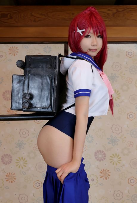 Asian girl Higurashi Rin displays her large boobs and poses in a swimsuit