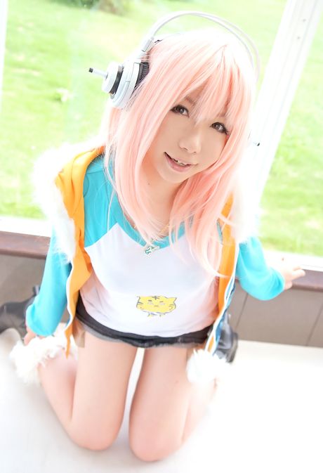 Pink haired teen Higurashi Rin presents her petite tits and her shaved pussy