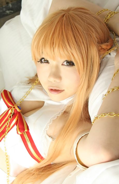 Asian teen Higurashi Rin wears a cosplay costume while posing in stockings