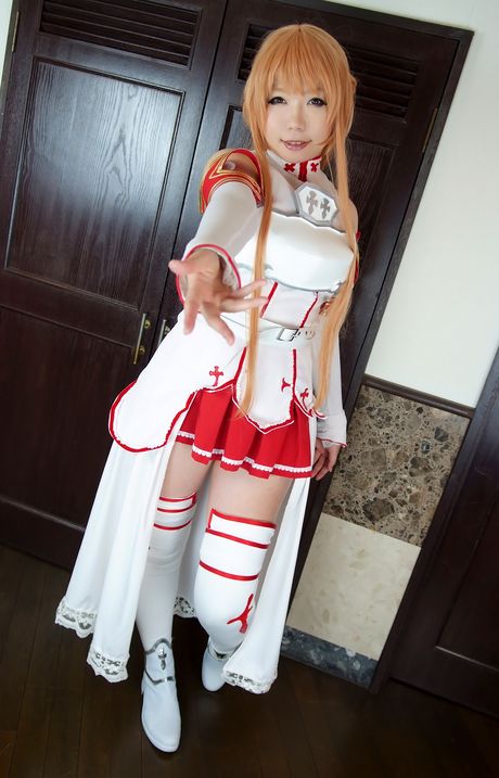 Asian teen Higurashi Rin wears a cosplay costume while posing in stockings